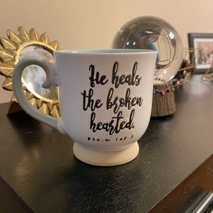 “He heals the broken hearted” mug